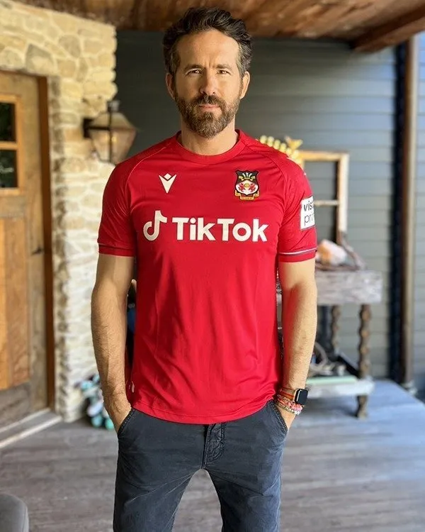 https://www.jacket-hub.com/wp-content/uploads/2022/10/Ryan-Reynolds-Wrexham-AFC-Red-T-shirt-1.jpg